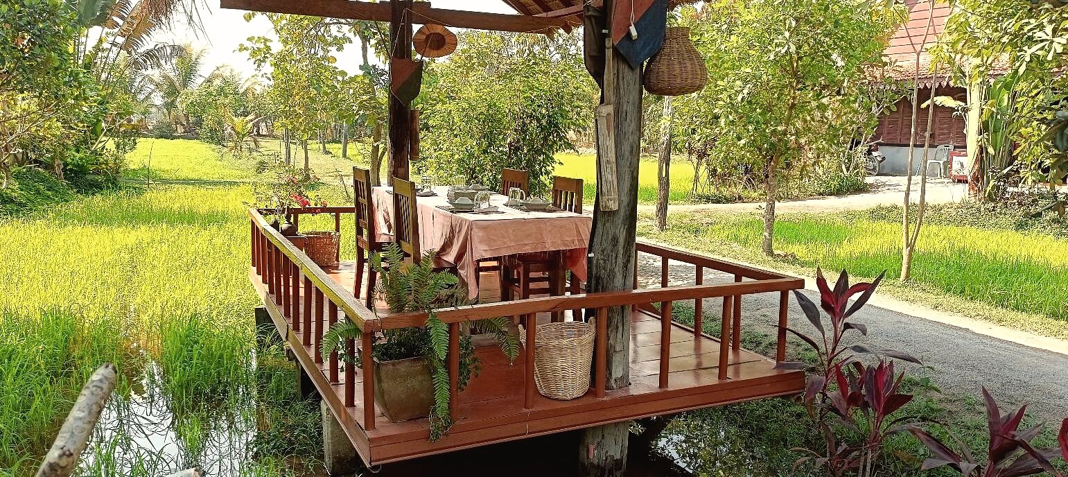 Long table dinner setup with Khmer dishes